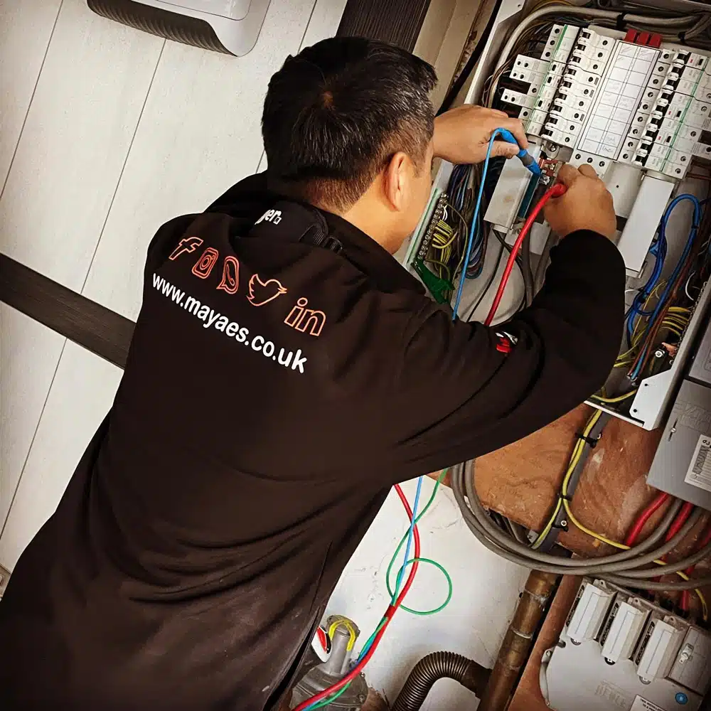 carlo ramos at work on fuse box for maya electrical services ltd